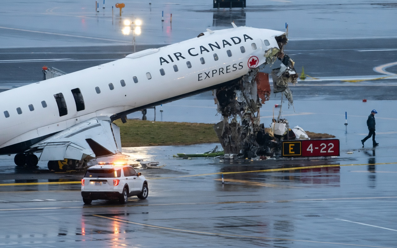 Aviation safety teams and investigators at LaGuardia Airport
