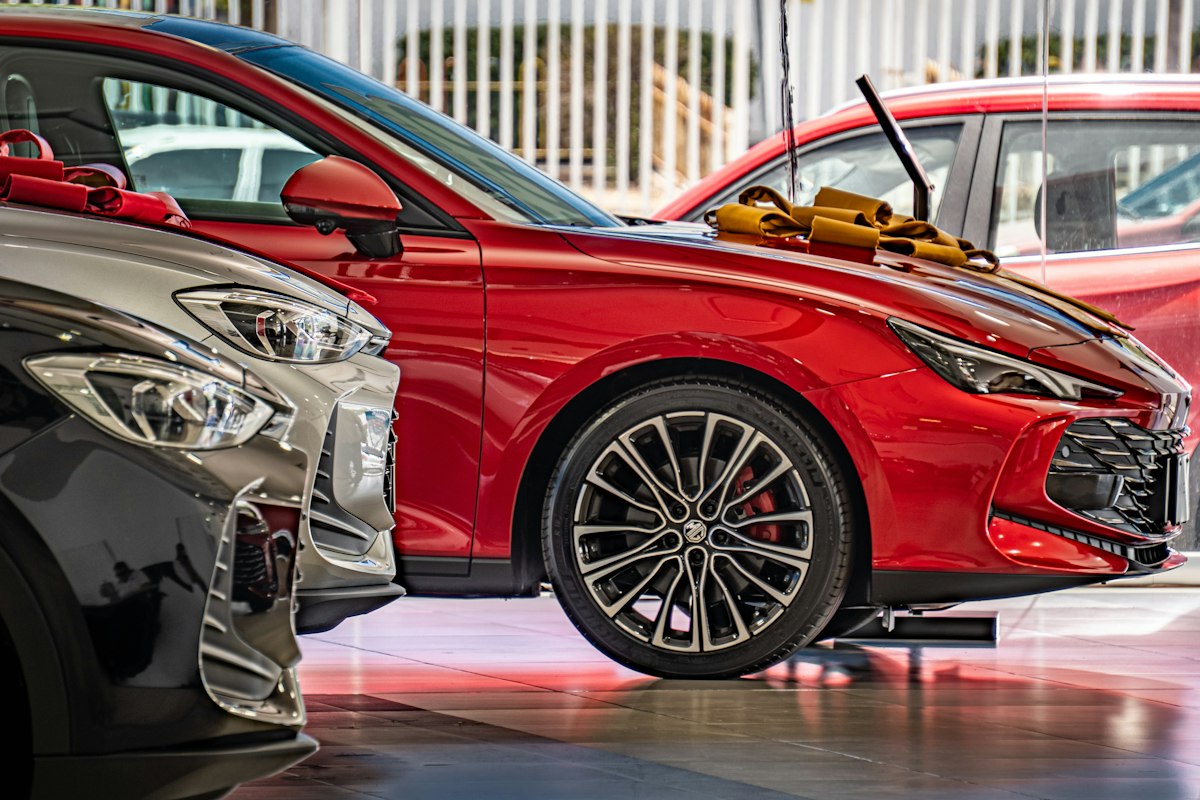Fake Car Dealership Websites: How to Verify a Dealer Before Sending a Deposit 1 Cars parked inside an auto dealership showroom